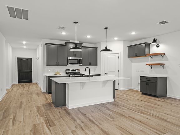 Kitchen with center island and pendant lighting