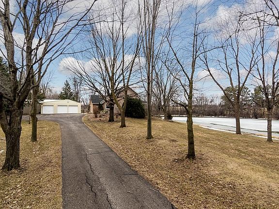 The home and garage/shop are set back in the five acre lot for privacy.