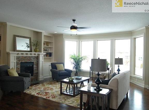 Simulated Photo - Greatroom with hardwood floors, fireplace, bui