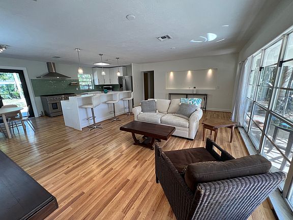 Love seat and suade/wicker chair.