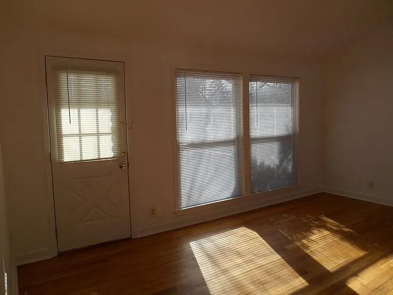 living room with door to outside decki