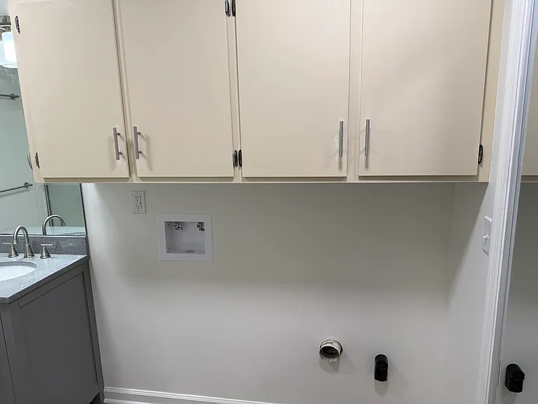 laundry hookups and cupboards