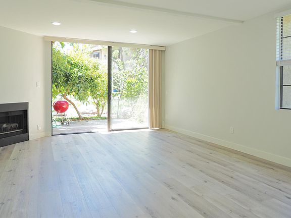 Living area and sliding glass door out to the patio
