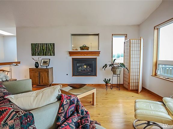 The split-level home has the living quarters, master suite, and guest bedroom with separate bath on the upper level.  