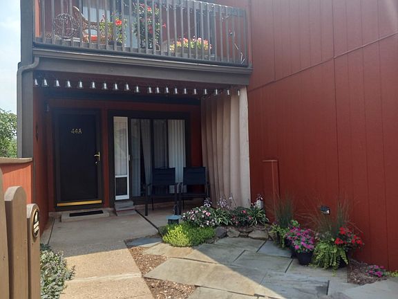 Front door and gated court yard with sliding glass doors