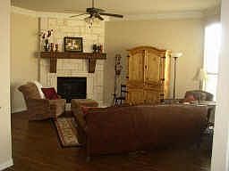 Stone fireplace with handscraped hardwoods throughout!