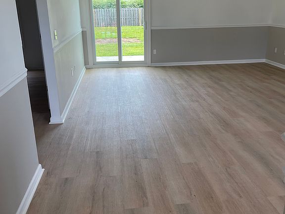 Walking in front door. Back door is brand new. All floors replaced with LVP flooring. All new paint throughout house.
