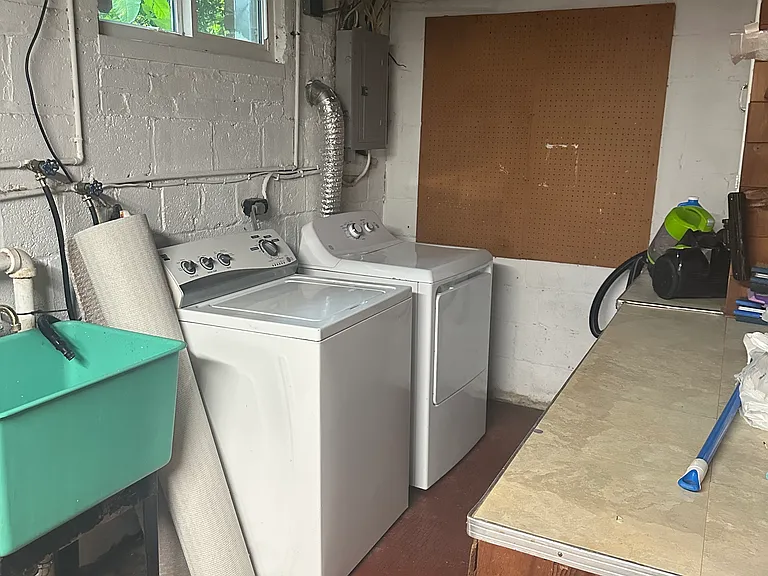 Utility room with washer and dryer