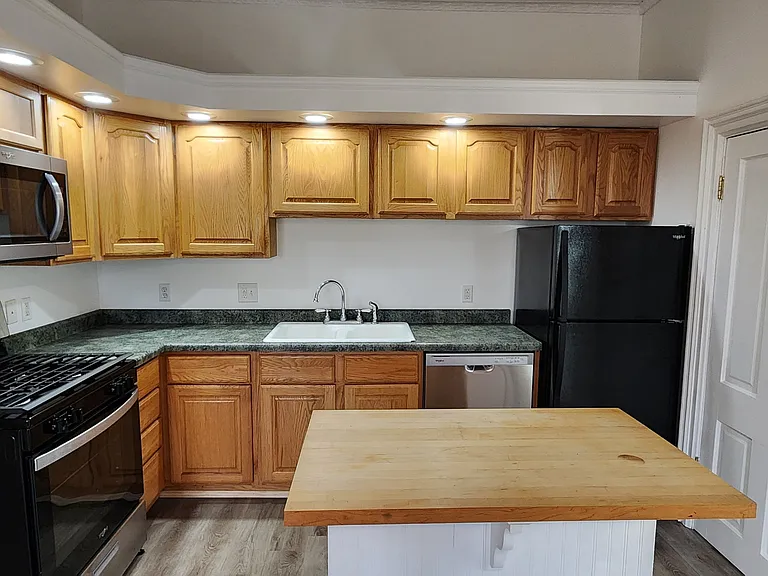 Kitchen with all new appliances. Dishwasher, Fridge, Microwave, Oven/Stove.
