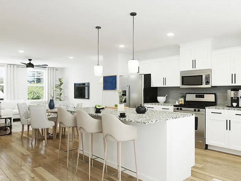 Spacious kitchen with an island, ample storage, and stainless steel appliances.