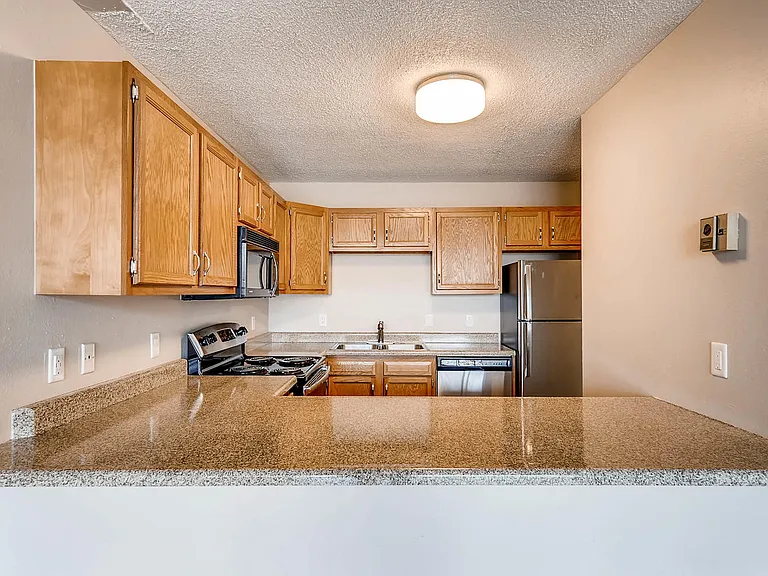 Our Apartment Kitchen with Stone Countertop at Scandia Apartments in Englewood, Colorado