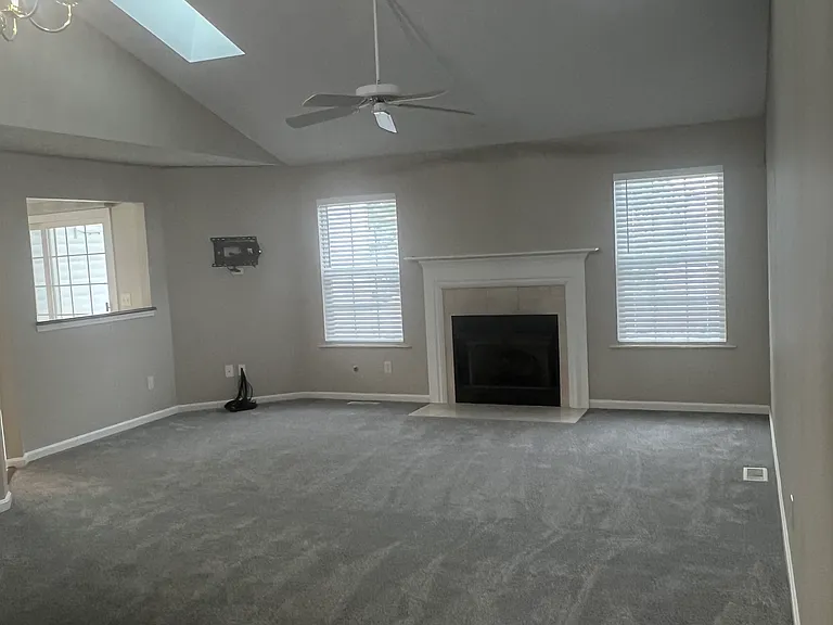 Living room with vaulted ceiling, plus skylights. Internet / TV Hookup.