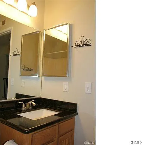 Powder Bathroom- Owner is considering refinishing cabinets