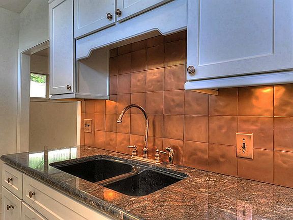 Gorgeous copper styled back-splash.
