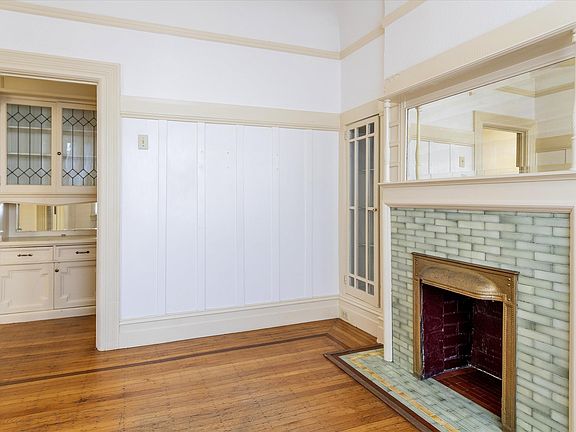 View of Built-ins in hallway and original crown molding details throughout the unit.