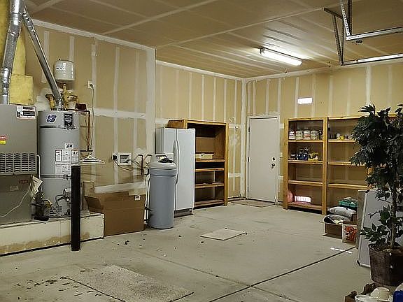 3 car garage with shelving