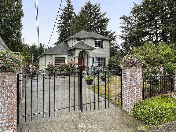 Secure Gated Entrance to this Fully Fenced Yard with Custom Built Adult Family Home.