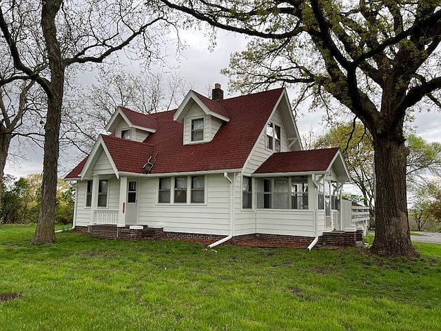 Front of house and sun porch