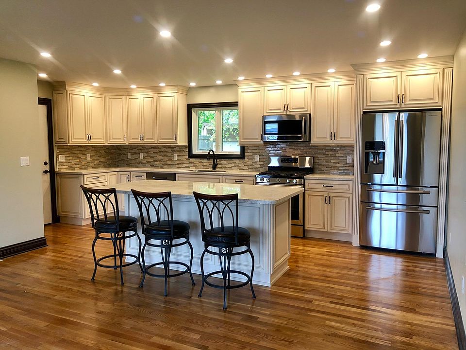 Open kitchen and living room with beautiful original hardwoo