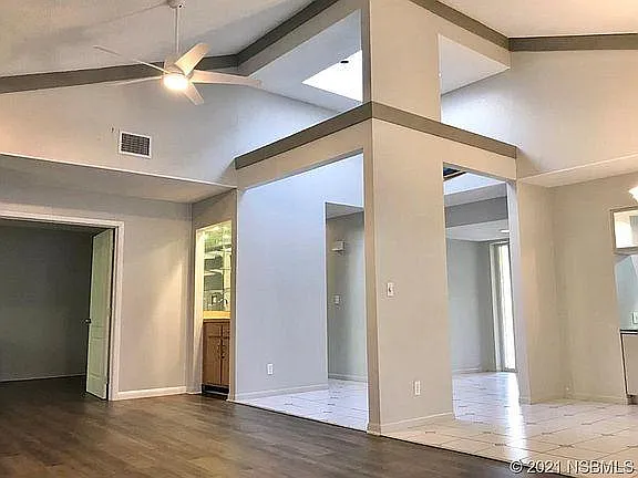 Soaring ceilings and skylights create a bright and spacious living space.