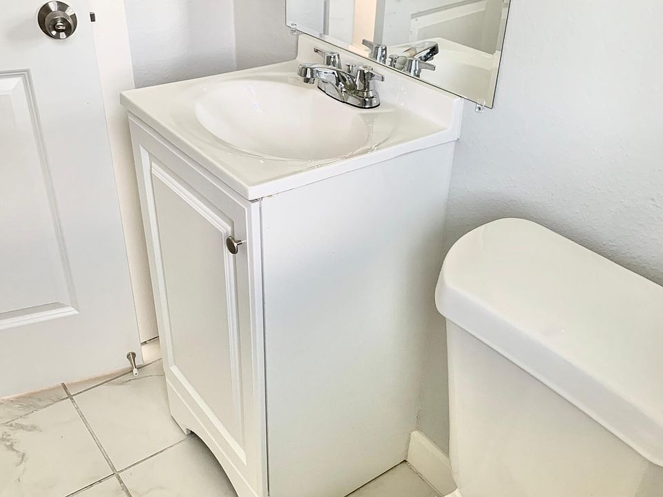 Brand new remodeled bathroom. New bathtub, sink, and toilet.