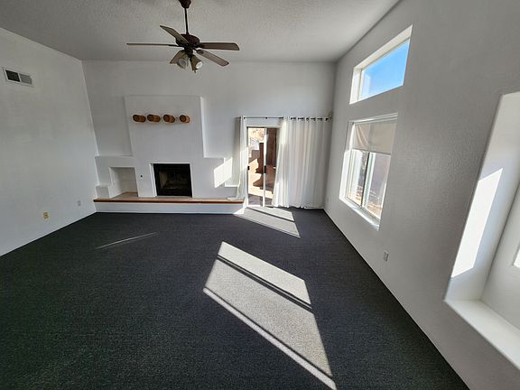 Living room. Brand new carpet and paint in 2026.