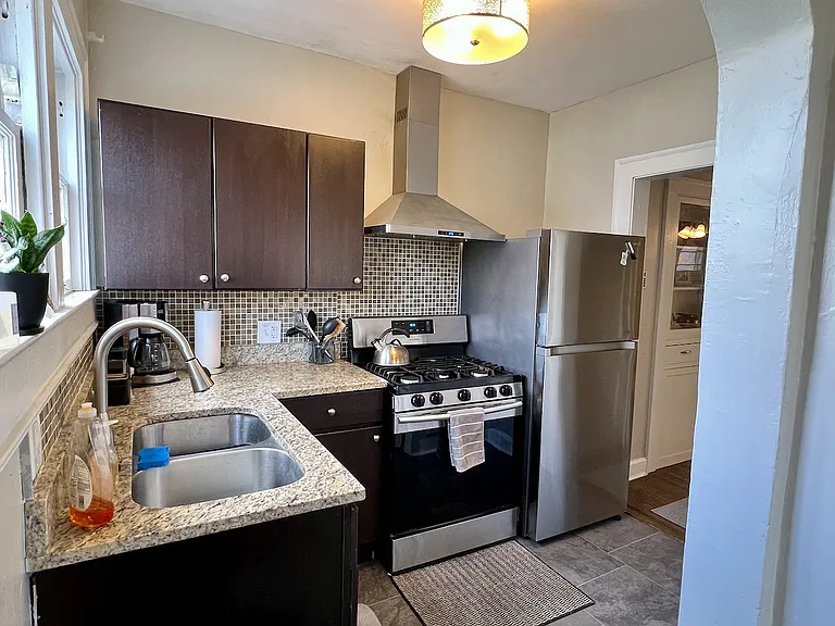 Granite countertops and all stainless steel appliances! Kitchen overlooks the backyard.
