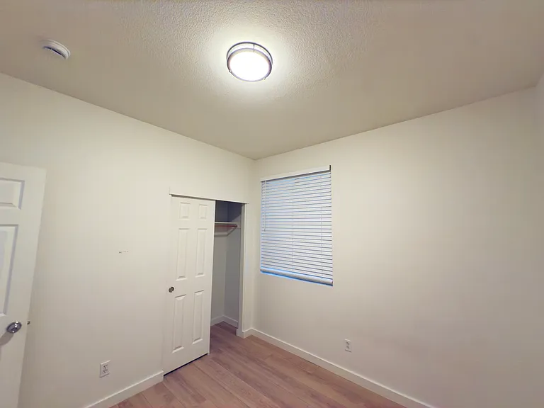 Room 3: A cozy and functional bedroom, filled with natural light, offering a comfortable space for relaxation.