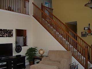 Spacious living room boasts a gas  fireplace and high ceilings.