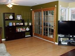 Living room w/wood floors, new sliders to patio
