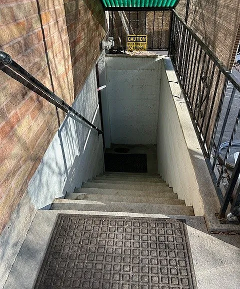 Private stairs to unit, automatic lights above door.