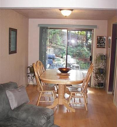 Nice pergo flooring. Big open kitchen next to the dining room. 