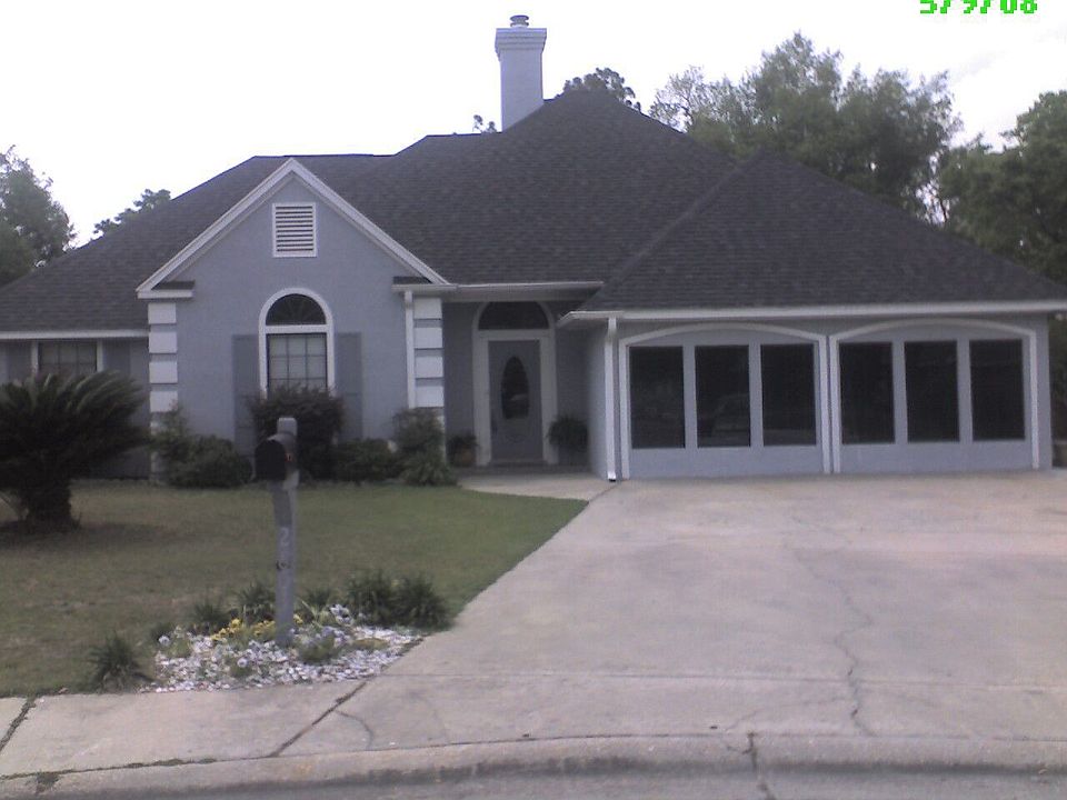 Beautiful Stucco Exterior with Tropical Landscaping