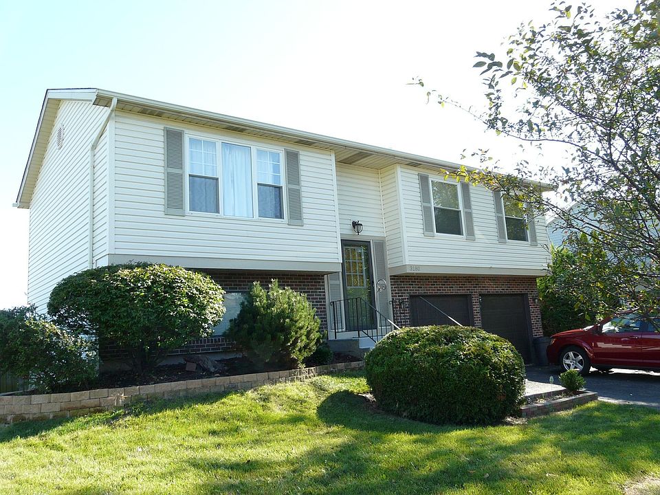 Front of house with 2 car garage located at Cul-de-Sac