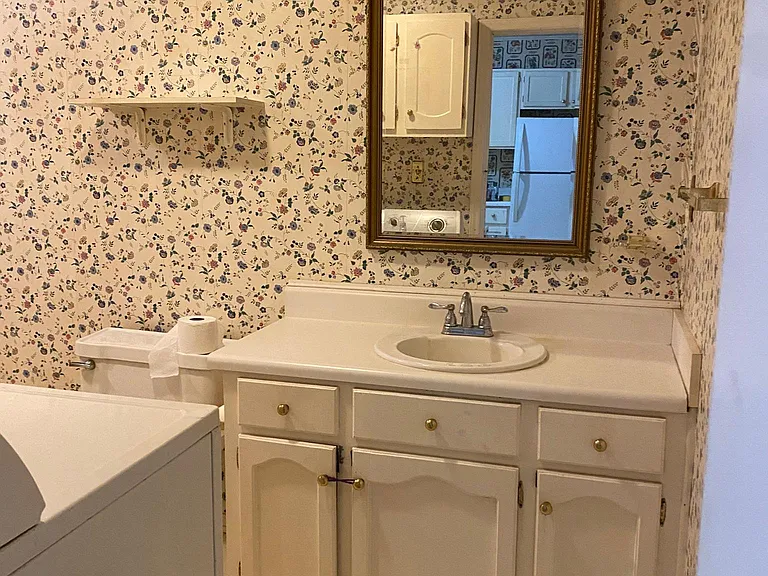 Large full bathroom with washer and dryer