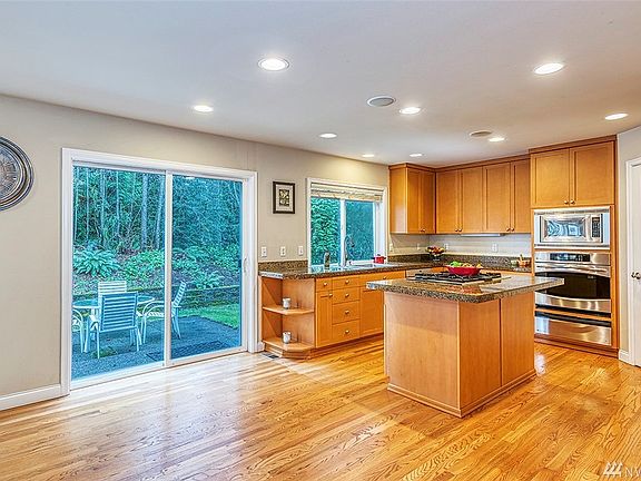 A large kitchen with extra open space and extremely private greenbelt backyard