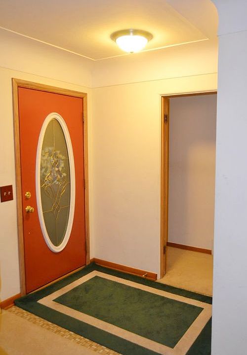 The Front door of the home is nicely accented with an oval lead glass window.  It has ceramic flooring and a nice size coat closet.  The entry opens into the Living room.