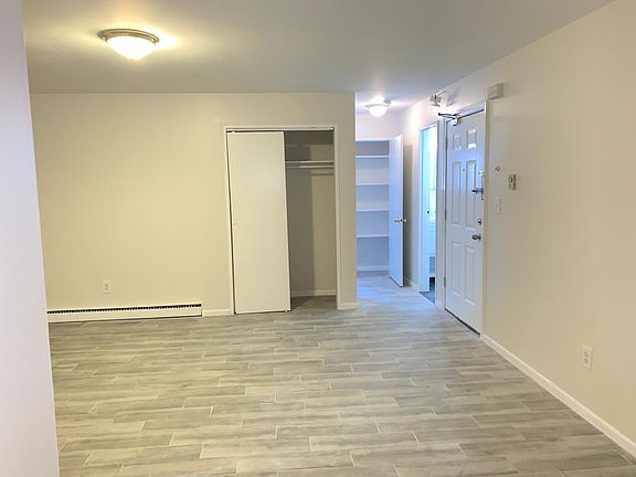 Living room facing bedroom and bathroom