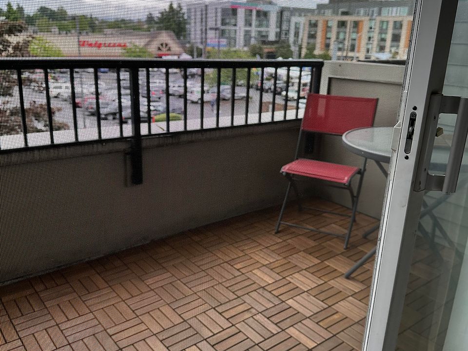 New wood tiles on balcony; create an outdoor living space!
