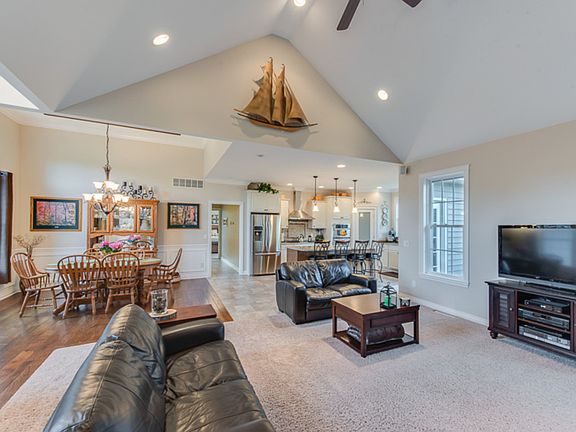 An amazing view of the light and bright open floor plan of the living room, dining room and kitchen.