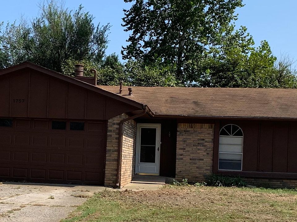 Front view - door faces West. Patio in back faces East.