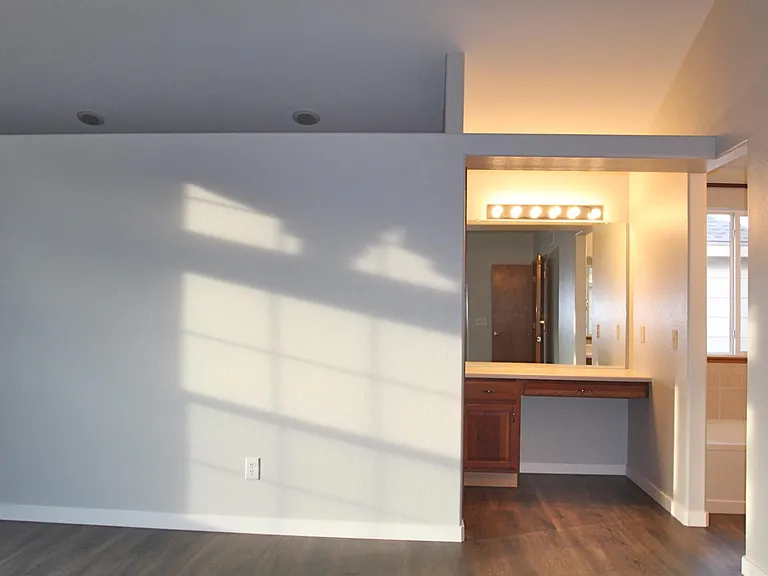 Dressing table is tucked in the primary suite