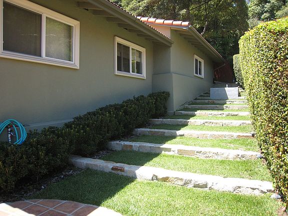 Terraced steps lead to second fountain/koi pond