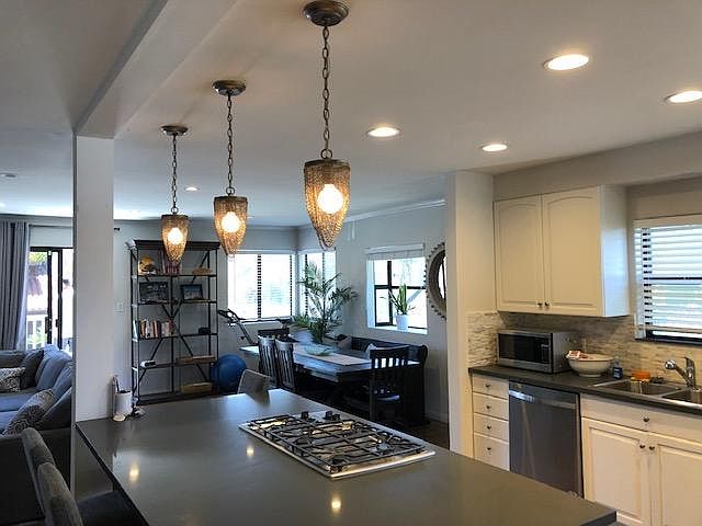 The kitchen/bar area with stainless steel appliances