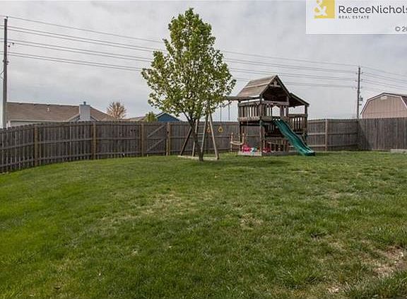 Privacy fence already up. Play set does NOT stay!