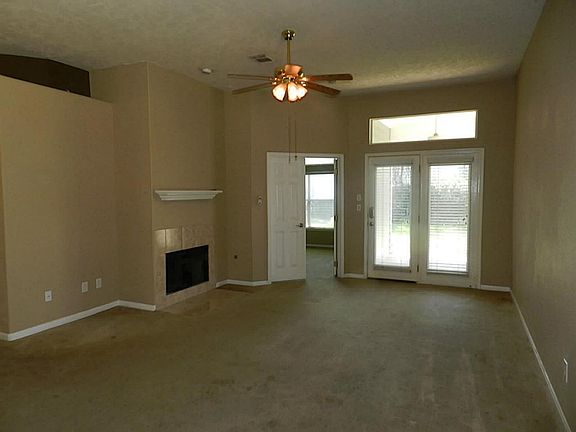 Gas fireplace in family room. French doors to private backyard