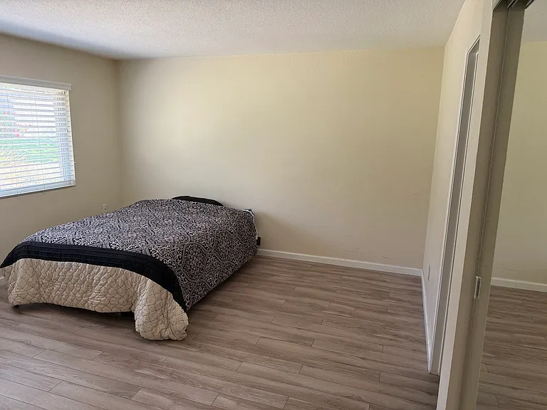 Master bedroom on first floor with attached full bath.