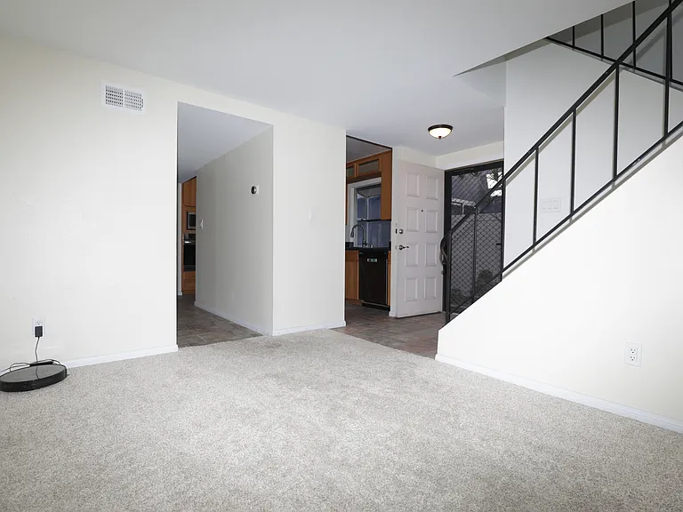 Front door and access to kitchen and hallway access to laundry room and further to garage