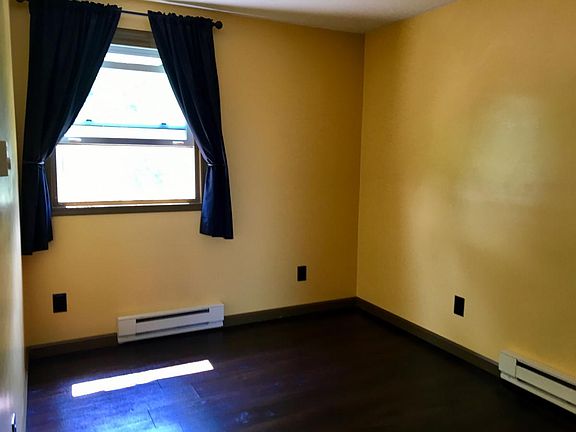 Your bedroom with the same beautiful dark hardwood floors, t