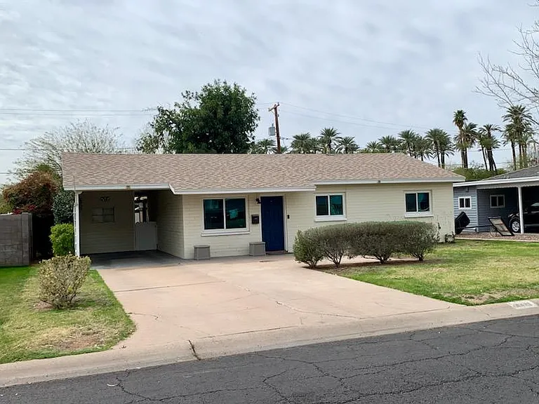 Angle view of front of home to highlight large front yard